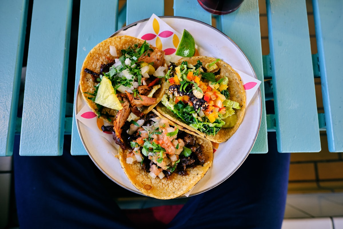Blackened mahi mahi fish tacos with slaw and avocado crema